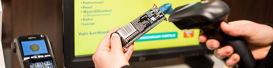 Person scanning the barcode on product